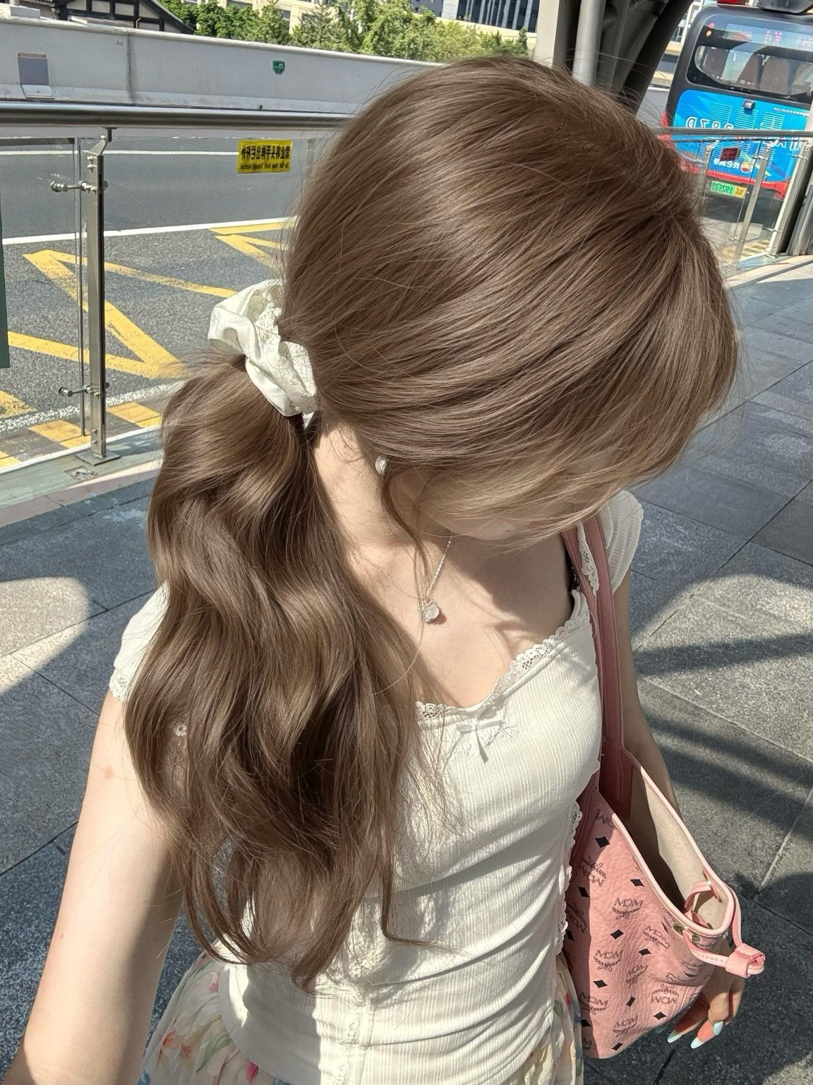 Warm brown extension low ponytail outdoor