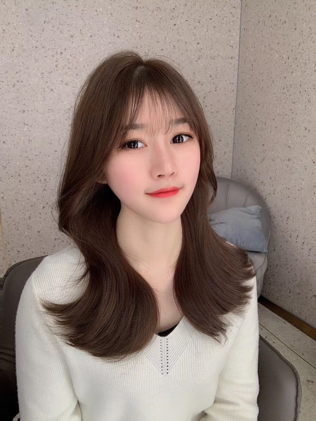 Natural brunette feather extension result at 3AM Hair Salon