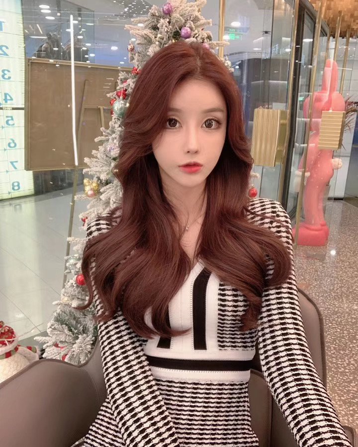 Copper red feather extension at 3AM Hair Salon Singapore